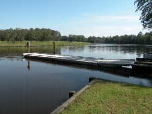 Floating dock between two boat ramps